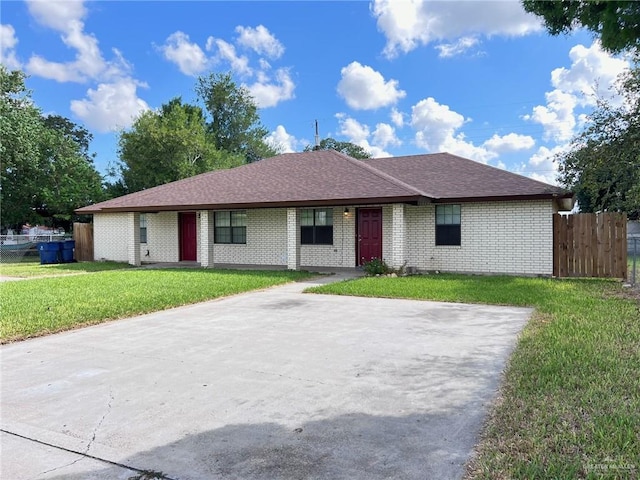 ranch-style house with a front lawn