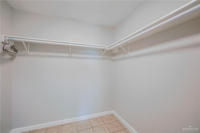 walk in closet featuring light tile patterned floors