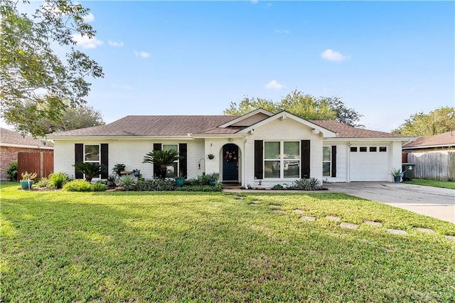 single story home with a garage and a front lawn