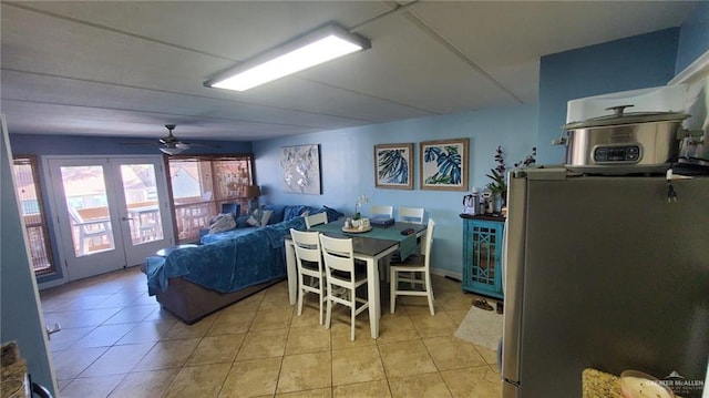 3113 Laguna Blvd Unit 219, South Padre Island, TX 78597 - dining area with ceiling fan, light tile patterned flooring, and french doors