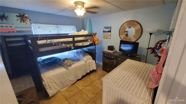 tiled bedroom with ceiling fan