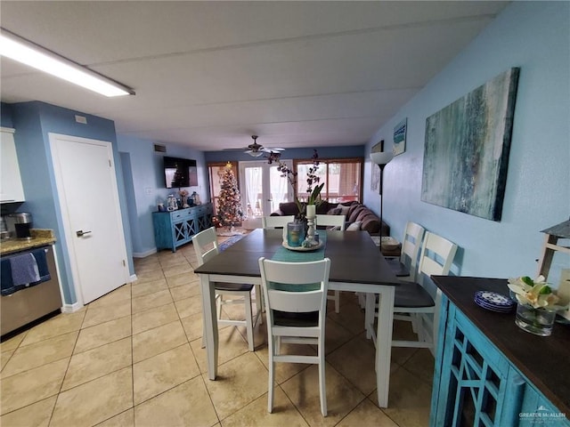 3113 Laguna Blvd Unit 219, South Padre Island, TX 78597 - dining space featuring a ceiling fan and light tile patterned flooring