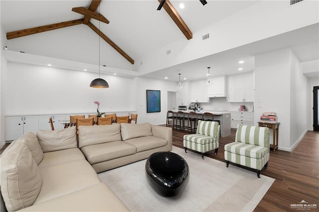 living room featuring high vaulted ceiling, beam ceiling, and hardwood / wood-style floors