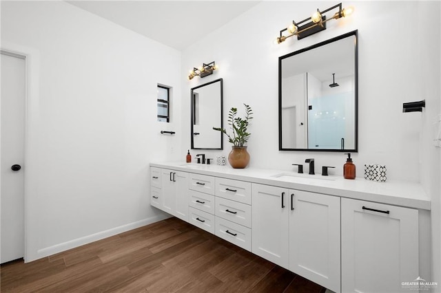 bathroom featuring vanity and hardwood / wood-style floors