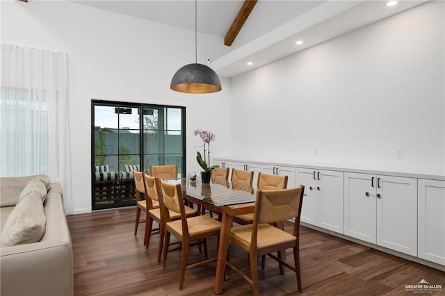 dining room featuring dark hardwood / wood-style flooring, beam ceiling, and high vaulted ceiling