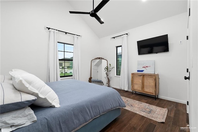 bedroom with dark wood-type flooring, high vaulted ceiling, and ceiling fan