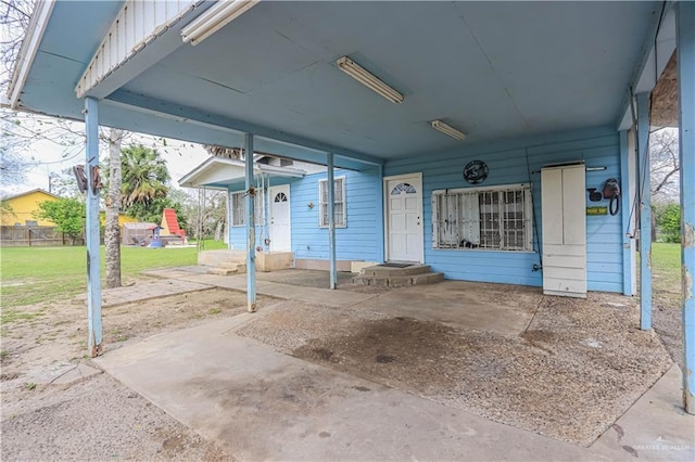 view of patio featuring an attached carport