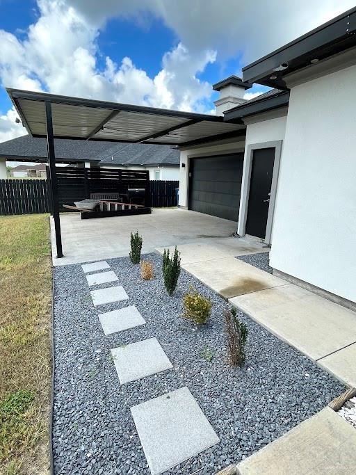 view of patio / terrace featuring fence