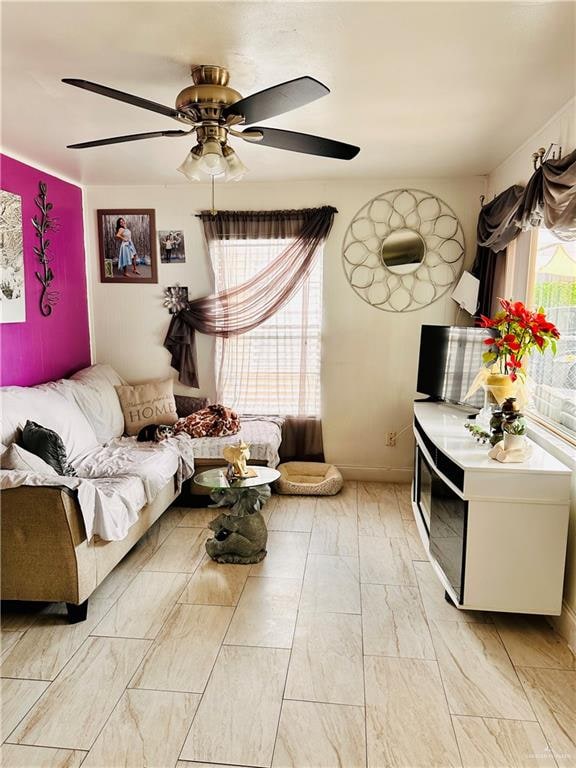 living room with ceiling fan