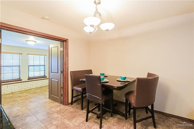 dining space with a chandelier