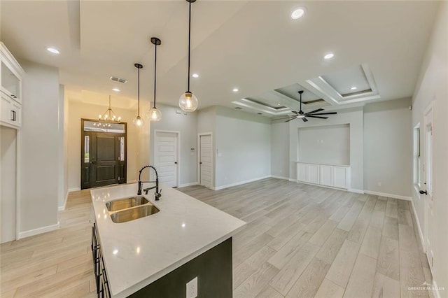 1310 S 9th St, Alamo, TX 78516 - kitchen featuring a sink, light wood finished floors, an island with sink, and recessed lighting