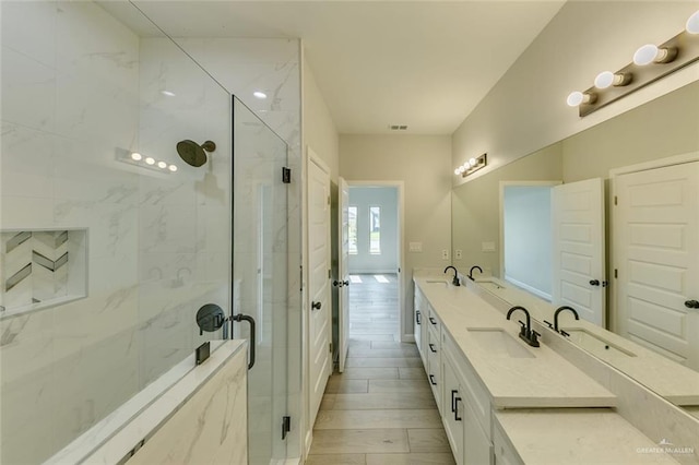 1310 S 9th St, Alamo, TX 78516 - full bathroom featuring a marble finish shower and double vanity