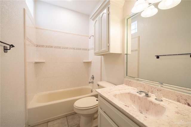 full bathroom featuring tile patterned floors, vanity, toilet, and tiled shower / bath