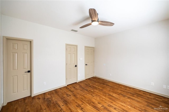 unfurnished bedroom featuring ceiling fan and wood-type flooring