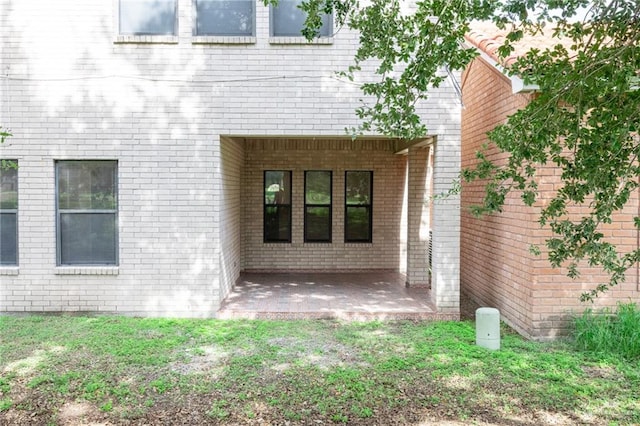 doorway to property featuring a patio