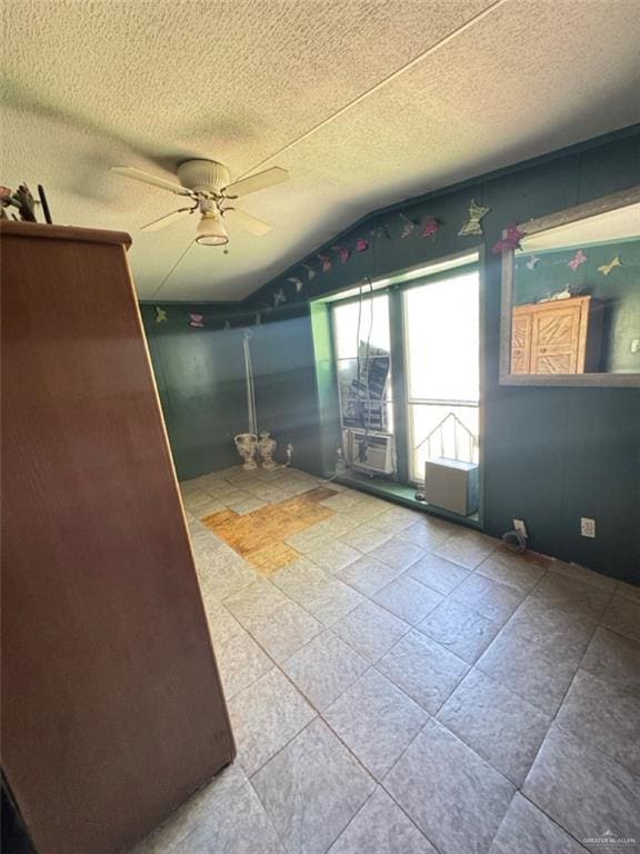 38639 W Centerline Rd, Los Fresnos, TX 78566 - spare room with lofted ceiling, a ceiling fan, and a textured ceiling
