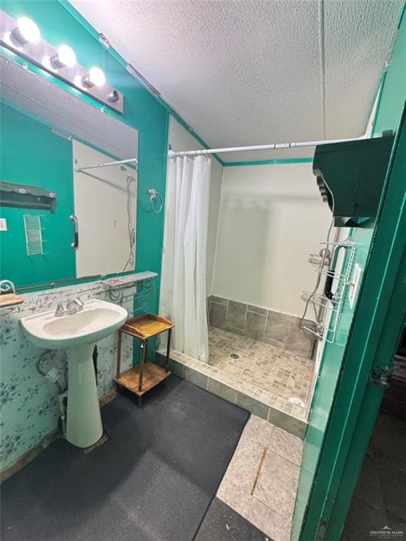 38639 W Centerline Rd, Los Fresnos, TX 78566 - full bath featuring a stall shower and a textured ceiling
