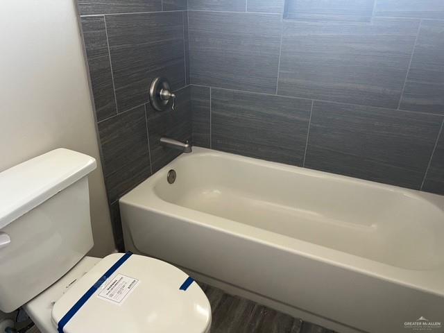 14405 Chalk Ridge Dr, Mcallen, TX 78504 - bathroom featuring toilet and tub / shower combination