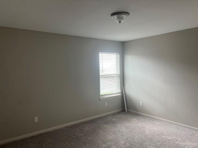 14405 Chalk Ridge Dr, Mcallen, TX 78504 - spare room with baseboards and carpet flooring
