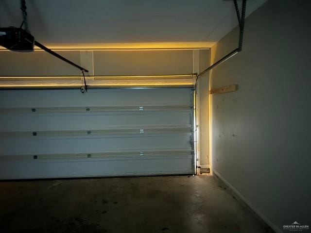 14405 Chalk Ridge Dr, Mcallen, TX 78504 - garage with a garage door opener and baseboards