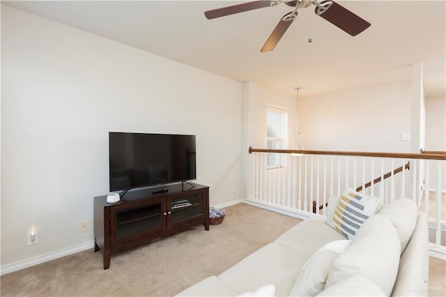 living room featuring ceiling fan and light colored carpet