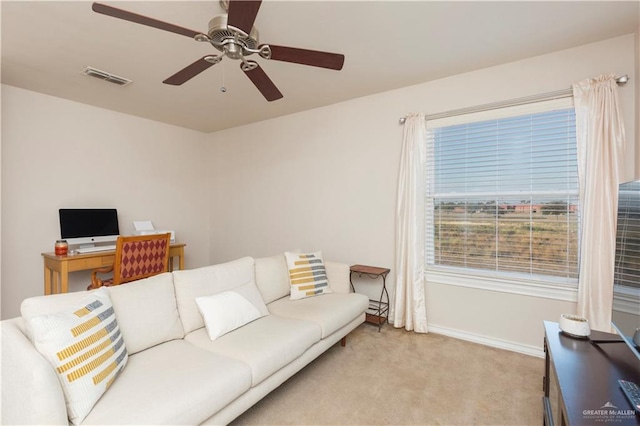 living room featuring light colored carpet and ceiling fan