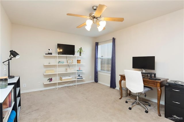 office space featuring ceiling fan and light colored carpet