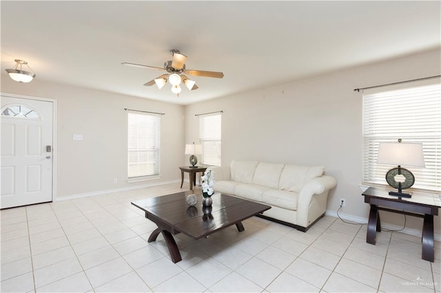 tiled living room featuring ceiling fan