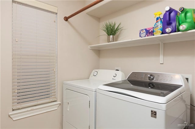 laundry area with separate washer and dryer