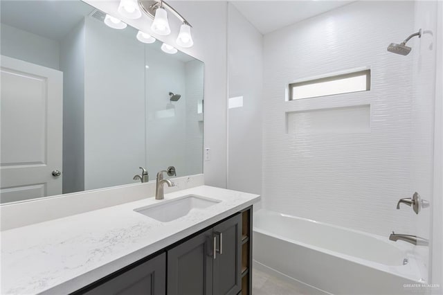 bathroom featuring bathing tub / shower combination and vanity