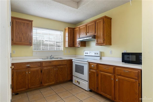 kitchen featuring black microwave, under cabinet range hood, a sink, light countertops, and white electric range oven