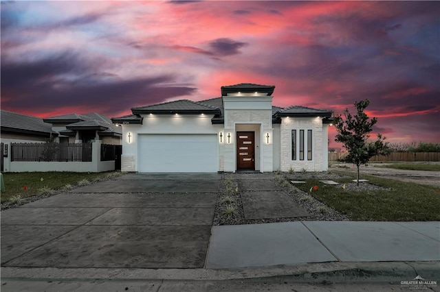 prairie-style house featuring a garage