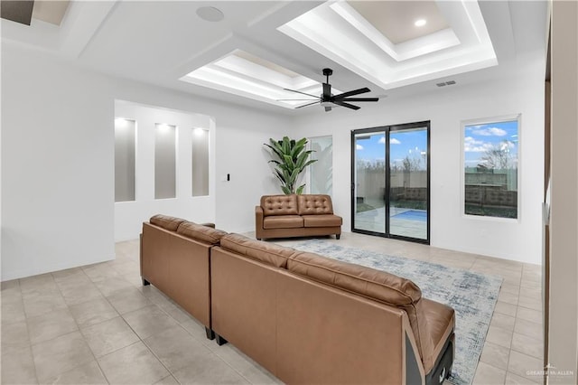 living room with light tile patterned floors and ceiling fan