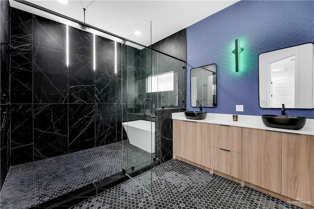 bathroom with vanity, plus walk in shower, and tile patterned flooring