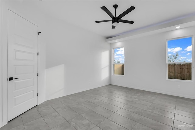 spare room with ceiling fan