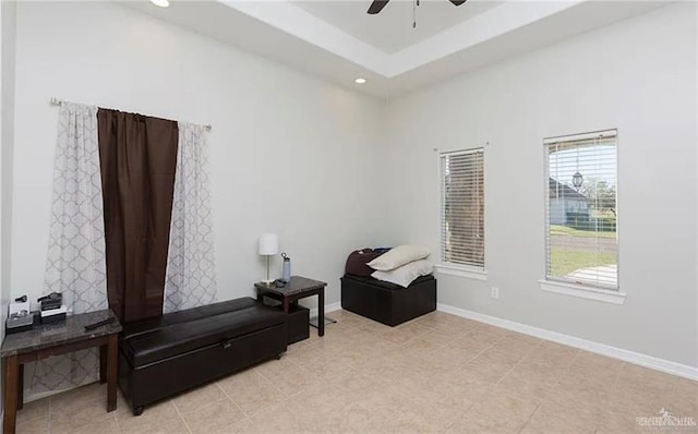 living area featuring baseboards, a ceiling fan, and recessed lighting