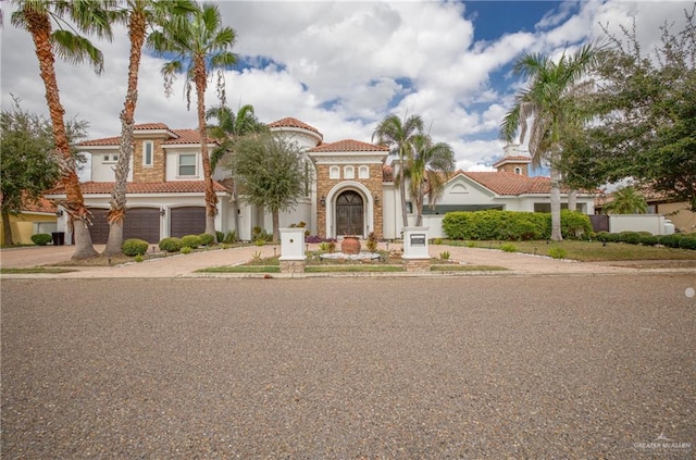 mediterranean / spanish-style home featuring a garage