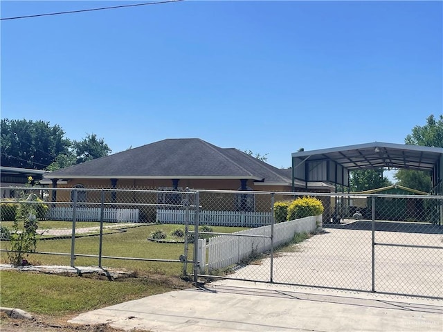 view of home's exterior featuring a lawn and a carport