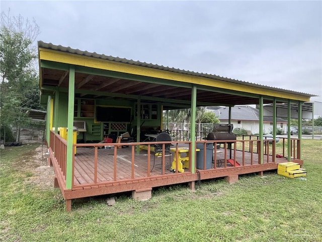 view of dock with a deck and a lawn