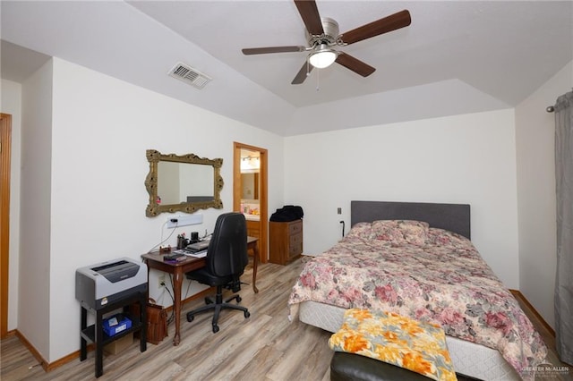 bedroom with connected bathroom, light hardwood / wood-style floors, and ceiling fan