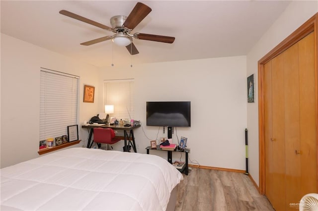 bedroom featuring ceiling fan and light hardwood / wood-style flooring