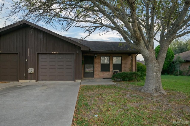 single story home featuring a garage and a front lawn