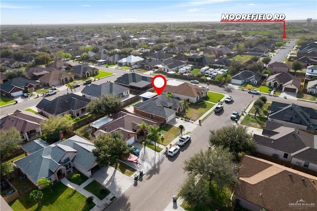 birds eye view of property with a residential view