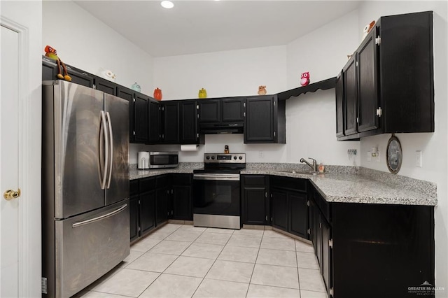 kitchen featuring sink, stainless steel appliances, and light tile patterned flooring