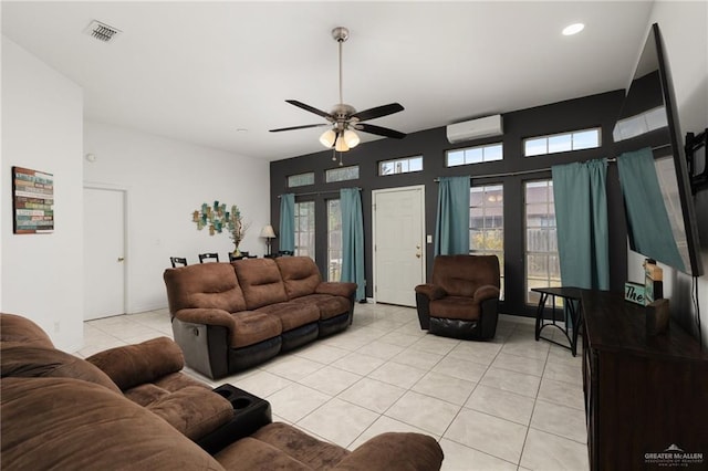 living room featuring a wall mounted air conditioner, ceiling fan, and light tile patterned floors