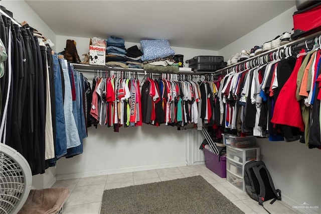 walk in closet featuring light tile patterned flooring