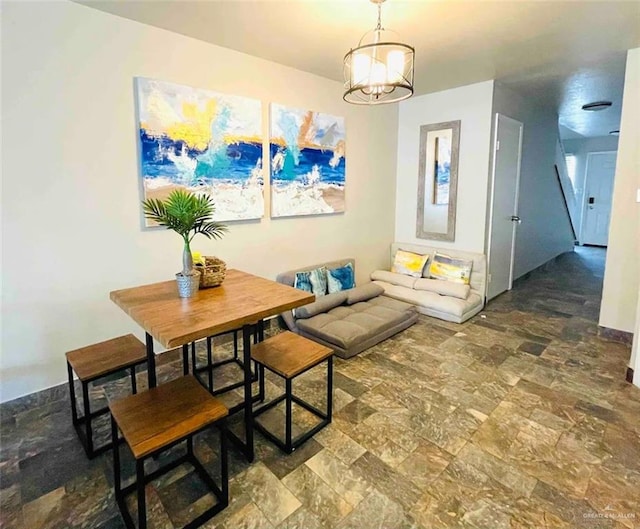 117B E Mezquite St, South Padre Island, TX 78597 - dining space featuring stone finish flooring and a chandelier