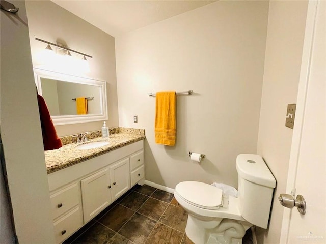 117B E Mezquite St, South Padre Island, TX 78597 - bathroom featuring toilet, vanity, baseboards, and tile patterned flooring