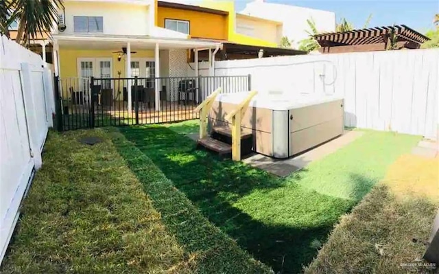 117B E Mezquite St, South Padre Island, TX 78597 - view of yard with a ceiling fan, french doors, and a hot tub