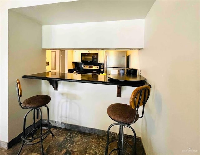 117B E Mezquite St, South Padre Island, TX 78597 - bar with stainless steel appliances and baseboards